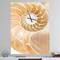 Designart Brown Nautilus Shell Pattern Wall Clock